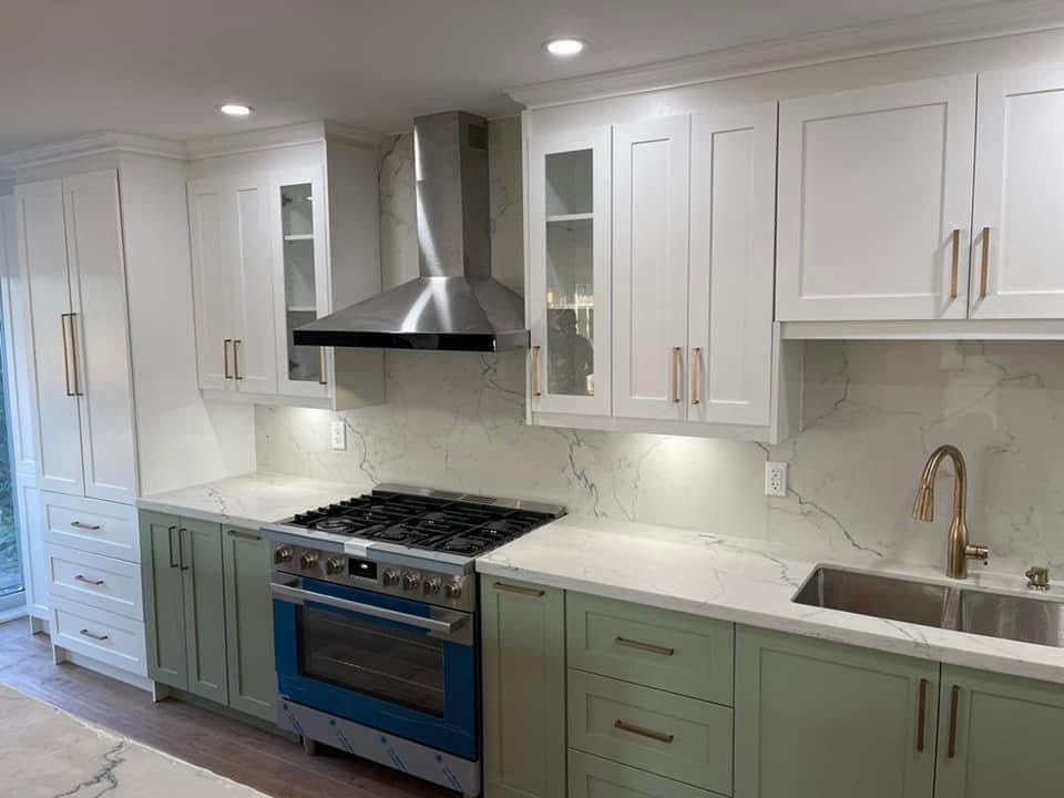 Sage green kitchen renovation with quartz countertops by Canadian Designs